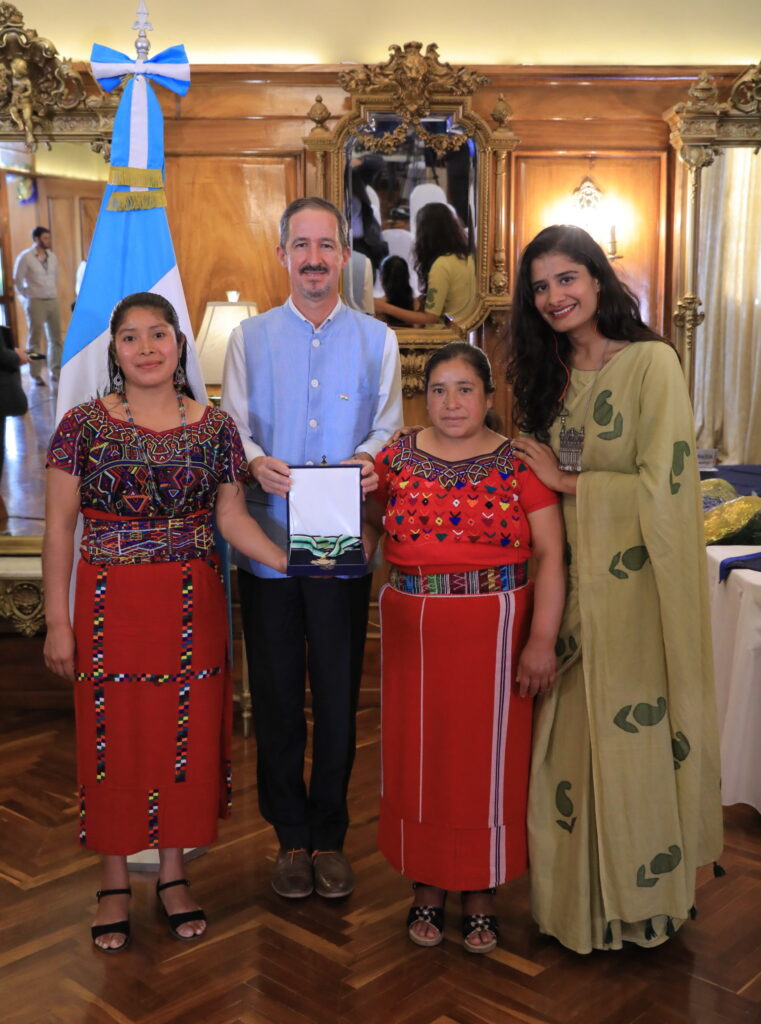 Rodrigo Paris stands with two Solar Mamas from Guatemala and a Barefoot College International teacher after the President of Guatemala presents Barefoot College International CEO with the Presidential Medal of Merit for our work on the environment 