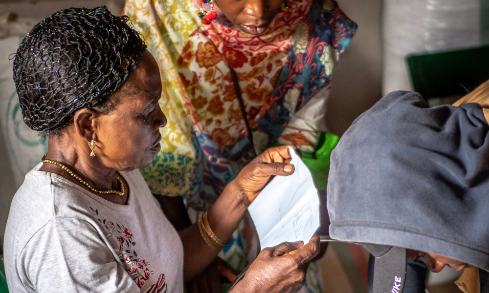 Neimbain Charlotte works on solar panels with her fellow solar engineers