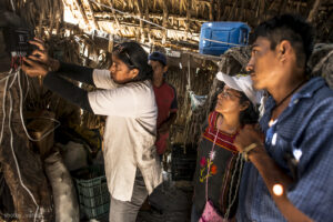 Norma from the village of Cachimbo, Oaxaca, Mexico finishes the installation for her neighbor. 