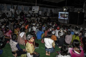 students watching the documentary film