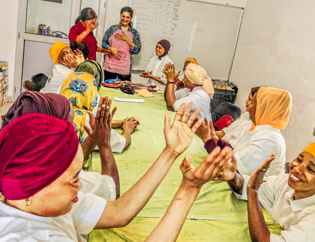 A group of women in Senegal learn about the female reproductive system during an ENRICHE class. This knowledge equips them to make decisions and breaks down stereotypes and stigma, which is essential to empower rural women.
